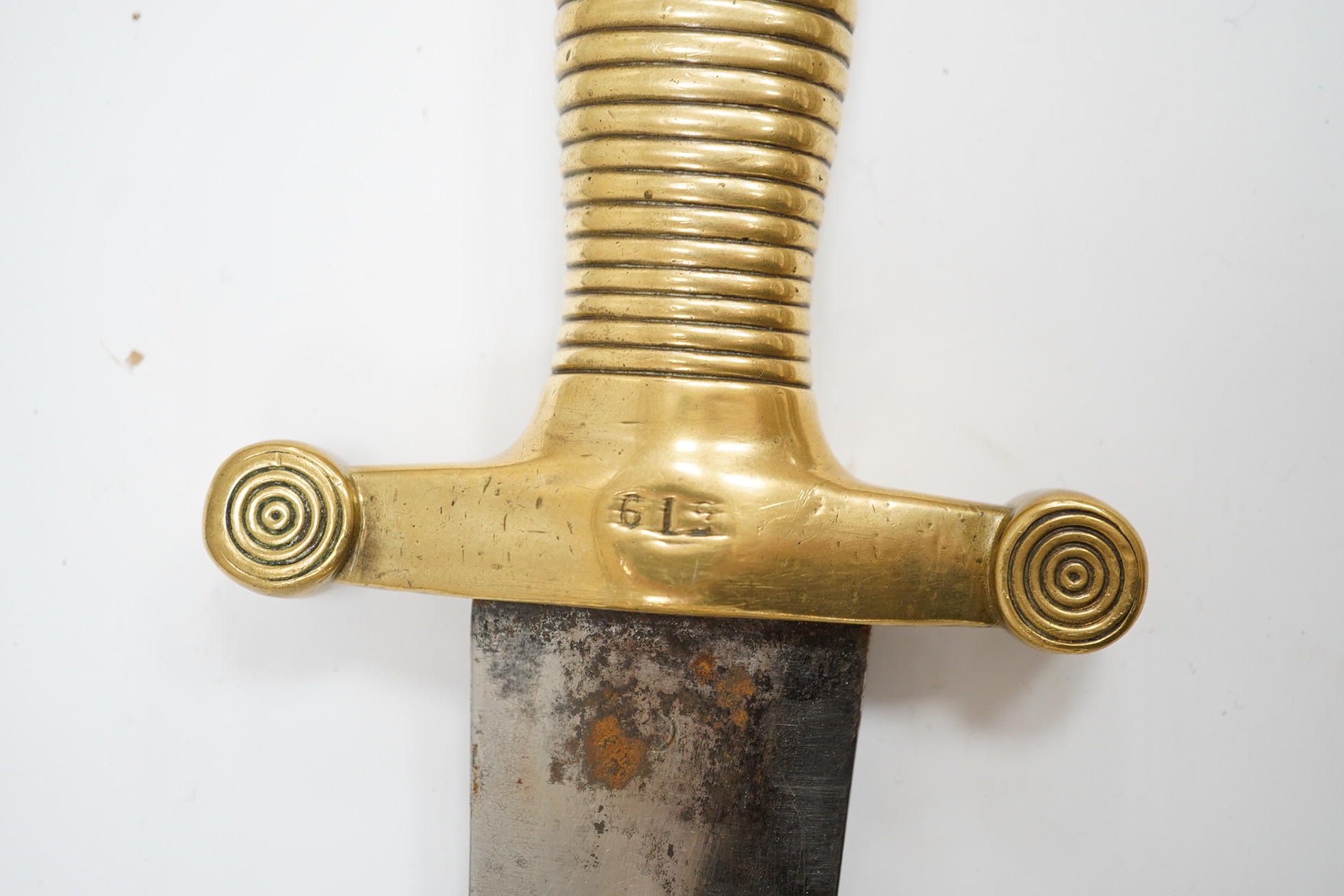 A 19th century French infantryman’s sidearm Gladius with swollen double edged blade, and regulation cast brass cruciform hilt, in its brass mounted leather scabbard, together with a continental bayonet also in scabbard.